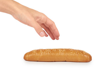 Light and delicious baguette bread in hand isolated on white background, home made food with sesame