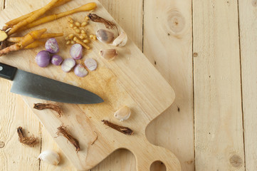 Top view of Thai food ingredients with knife on wooden backround