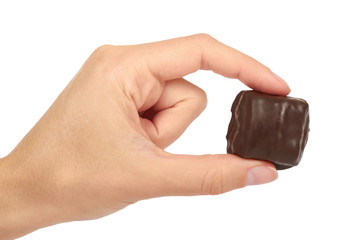 gourmet Chocolate bar in hand isolated on white background, home made sweets, unhealthy food