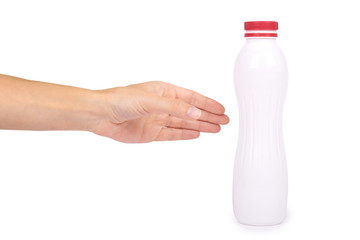 bottle of yoghurt with a red cap in hand isolated on white background, healthy lifestyle, plastic container for milk