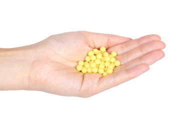 Fototapeta premium Medicine vitamins in hand isolated on white background