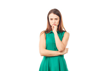 Portrait of emotional young woman in emerald green dress on white background