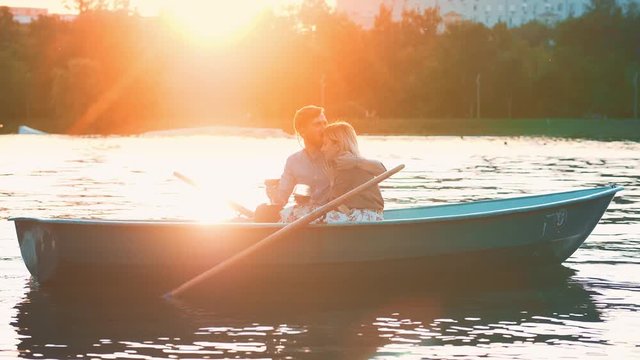 Romantic young couple in a boat