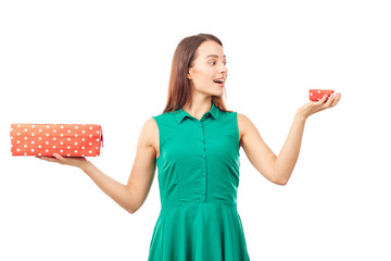 Portrait of young woman holding big gift box in one hand and small in another
