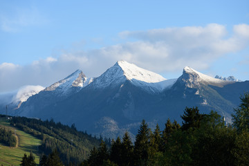 mountain tops in  autumn covered in mist or clouds