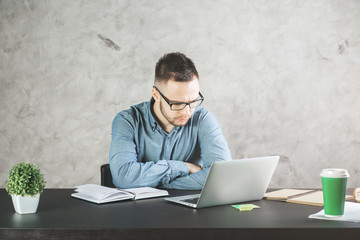 Attractive business man working on project