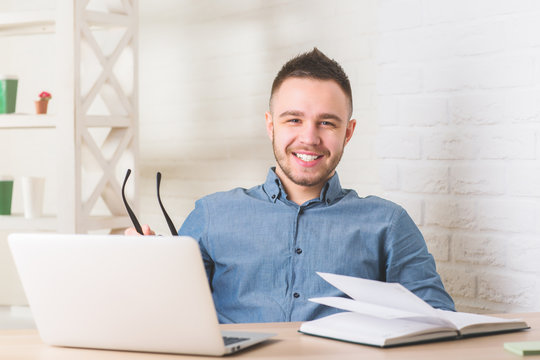 Smiling businessperson working on project