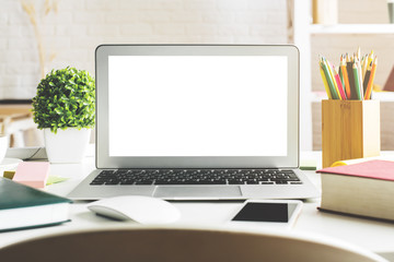 Fototapeta premium Creative desktop with empty white laptop screen
