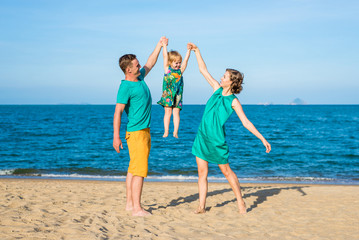Happy family on the beach. Family look