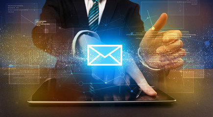 Businessman typing and mailing icon above