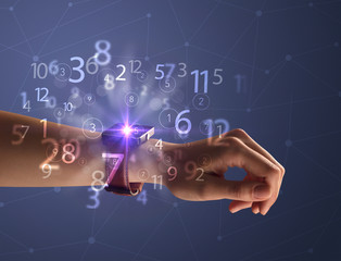 Close up hand with smartwatch and numbers