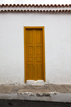 Fototapeta Withered facade with window of an old Italian town house. Cracks in the wall. Byzantine frame.