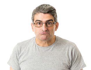 Obraz premium portrait of 40s weird and nerd man on glasses in ridiculous silly and stupid face expression looking at camera isolated on white