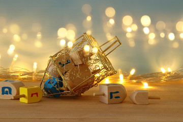 image of jewish holiday Hanukkah background with menorah (traditional candelabra) and burning candles. © tomertu