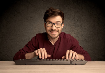 Computer geek typing on keyboard