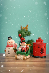 Christmas holiday background with Santa and decorations. Christmas landscape with gifts and snow. Merry christmas and happy new year greeting card with copy-space.