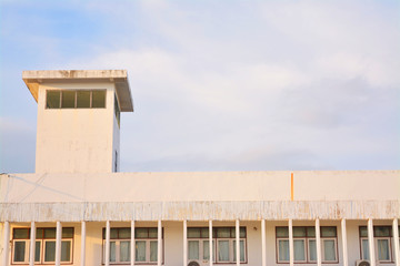 White building with before sunset background.