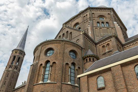 Facade church with windows and towers in Oss, The Netherlands