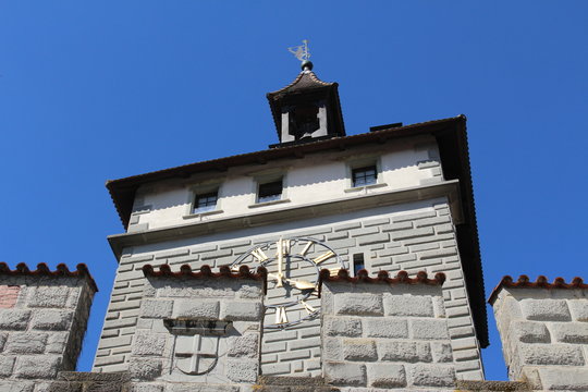 Historical Schnetztor gate of the former city walls built in 14th century isolated on blue sky in the city of Constance (Konstanz) in Baden-Wuerttemberg, Germany.