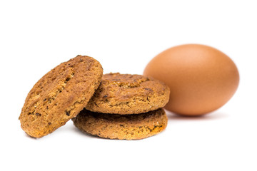 Easter cookies and egg on white background
