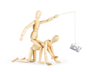 Man rides on another person and rules him with a bundle of dollars. Abstract image with wooden...