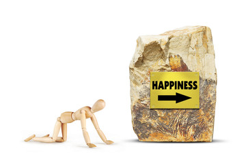 Tired man creeps towards happiness. Abstract image with a wooden puppet