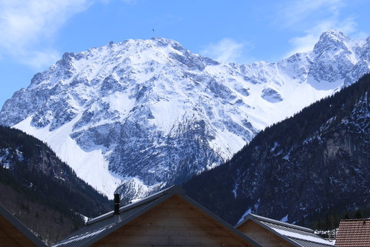 A view of snowy Alp mountains near Luener Lake (Luenersee) in Brand, Bludenz, Vorarlberg, Austria.