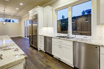 Large, spacious kitchen design with white kitchen cabinets