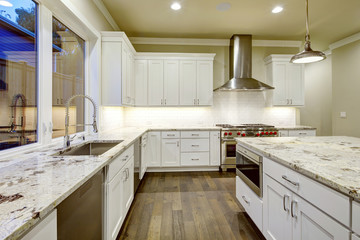 Large, spacious kitchen design with white kitchen cabinets