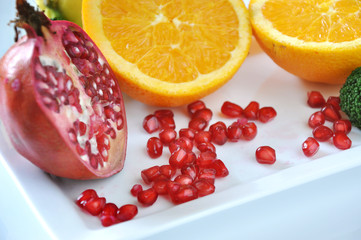 Close up Fresh Pomegrante Seed with Colorful Fruits on Background