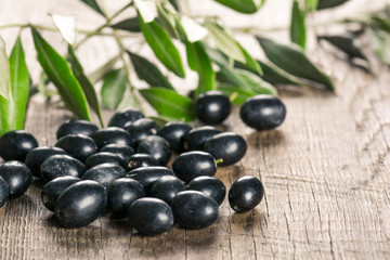 Olives on wooden background