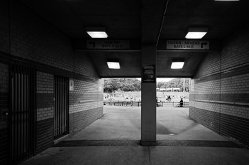 Passageway to sports arena in black and white