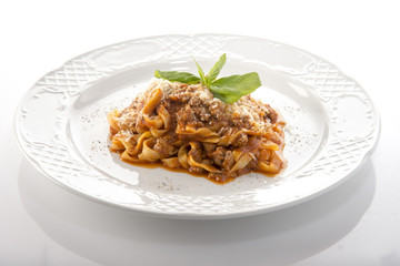 pasta with bolognese meat sauce and grated cheese