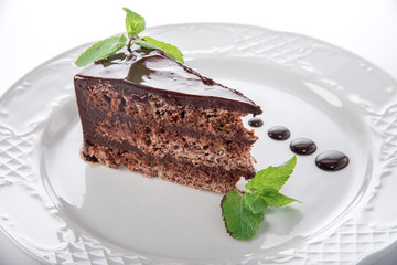 piece of chocolate cake with leaves