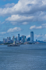 Fototapeta na wymiar Statue of Liberty with Jersey City in Background