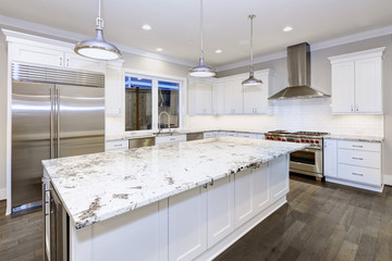 Large, spacious kitchen design with white kitchen cabinets