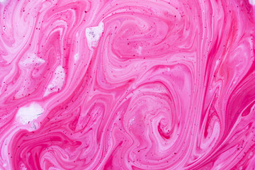 Closeup abstract color mixing of acrylic for use as background. Acrylic texture with marble pattern, pink marbling background 
