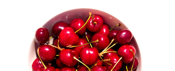 Cherry. Cherries in white bowl. Cherry on white background.