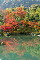 Autumn colors and pond reflections at Sogenchi Garden at Tenryu-ji temple..Designated as a Special Place of Scenic Beauty and UNESCO World Heritage Site