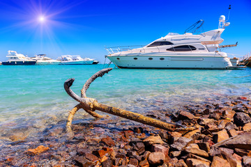 old anchor and yachts © Volodymyr Shevchuk