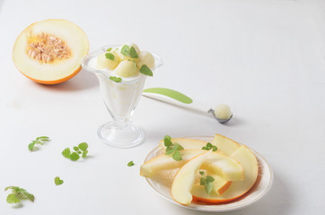 Dessert in a glass vase and melon and milk yogurt