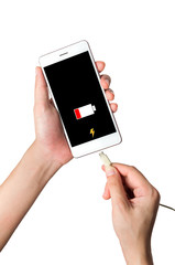 The smartphone in hand is charging the battery