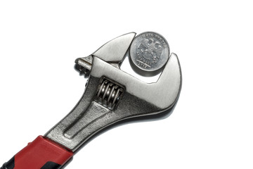 The coin in vise on the white background as a symbol of economic sanctions against of Russia