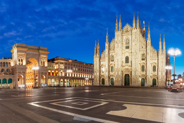 Fototapeta na wymiar Panorama of the Piazza del Duomo, Cathedral Square, with Milan Cathedral or Duomo di Milano and Galleria Vittorio Emanuele II, during morning blue hour, Milan, Lombardia, Italy