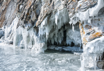 ice cave and icicles on the lake