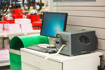 Computer for inventory of products with sticker printer in hardware store 
