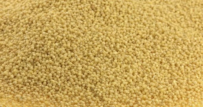 Close up of dry spilled millet rotating