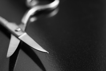 Background with manicure scissors, black and white photo, soft focus