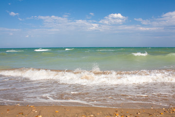 Adriatic Sea coast view. Seashore of Italy, summer sandy beach with clouds on horizon.