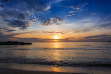 Panoramic views of the sunrise with spectacular sky over the sea.